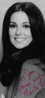 Childhood photo of a girl with her parents in 1966