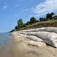 Polypropylene bags prevent property damage due to heavy rain. Geotextile Tubes Sand Bags Installation Superior Groundcover