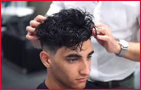 This modern men's haircut simply balances to wear short hair with just enough length for hair to roll. Latest Hairstyles For Boys Curly Hair Novocom Top
