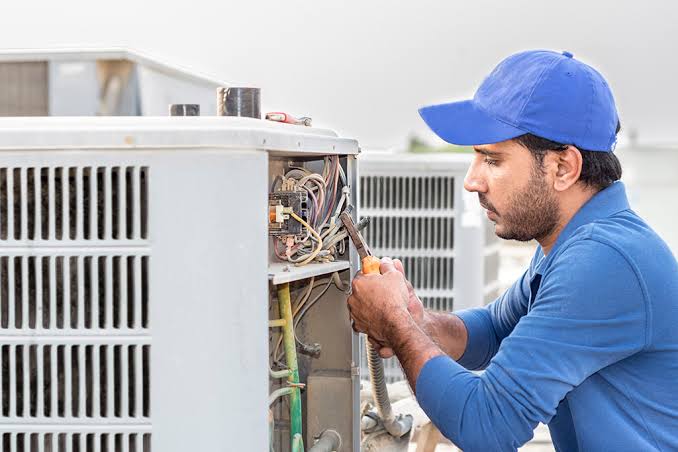 Professional HVAC technicians providing heating and cooling service