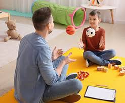 child playing with adult adhd therapist