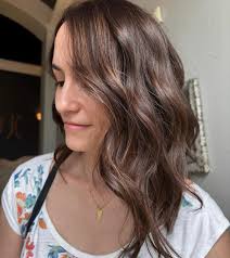 Cowgirl Copper Mermaid with a beautiful long layered haircut and bangs.  🤎🤠🧜‍♀️ @Schwarzkopf Professional Igora Vibrance Roots 7/57+a dash of  5/67 +13v Mids and Ends 7/77+13v • Styled with @Kenra Professional •