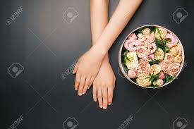 Share your love with friends & family even better with our free shipping in india & worldwide express delivery. Box With Beautiful Flowers Next To Womans Hands On The Black Stock Photo Picture And Royalty Free Image Image 163316157