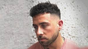 Side swept quiff foto of wave haircut. French Crop With Curly Hair Man For Himself