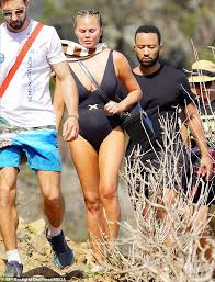 John legend and chrissy teigen in cannes, france, in june. Chrissy Teigen Dons Plunging Black Swimsuit For Hike With Husband John Legend And Pals In St Barts Daily Mail Online
