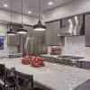 The light gray background of the stone allows it to contrast with white cabinets that can brighten up a kitchen, but this stone can also go well with dark gray or black cabinets without bringing down the mood of your room. 1