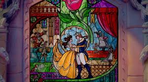 As the story ends, an animatronic of the beast emerges from a balcony on the right gazing at the enchanted rose while belle comes in from the left balcony holding a lantern, asking the beast to come into the light. Winter Turns To Spring I Love This Stained Glass Window At The End Of The