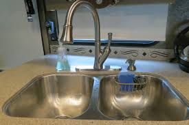 How to replace a kitchen sink without plumber and then set the sink to the countertop hole. Life Rebooted Replacing Our Kitchen Faucet