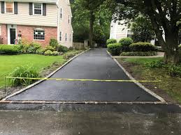 The edgings stones will stop any slate, shingle, stone or bark you are using for the drive or path from spilling over the edge and looking messy. New Asphalt Driveway With Belgian Block Border In Short Hills Nj Maloney Paving And Masonry
