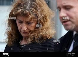 Karen Buck, accompanied by Detective Inspector Martin Brunning, reads a  statement outside the Old Bailey in London following the sentencing of Ian  McLoughlin who pleaded guilty to murdering her husband Graham Buck