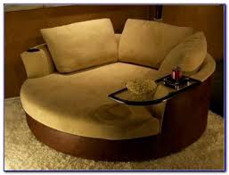 Whether your aesthetic is urban hip or suburban chic, this posh swivel chair is sure to look and feel right at home. Wooden Cabinets Vintage Oversized Round Swivel Chair