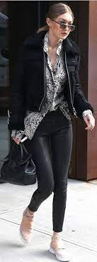 Who Made Gigi Hadid S Black Leather Pants Tan Sneakers Shearling Jacket And Handbag Black Leather Pants Leather Pants Shearling Jacket
