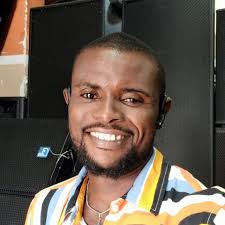 This guy explains to a crowd of cattle how he's not able to get the well  going to give them water but fortunately, someone is coming in an hour to  give them