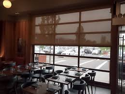 Tocolo Cantina Has A Glide Out Glass Wall We Made A Custom Lutron Motorized Solar Shade To Keep The Glare Out Motorized Solar Shades Solar Shades Garden City