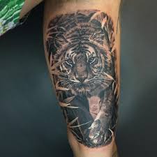 Men like to have a tiger tattoo on their body due to its powerful meaning. Powerful Tiger Tattoo Meaning Design 1984 Studio