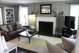 15 Cozy Living Rooms With Fireplaces Page 2 Of 3 Grey Walls Living Room Living Room Decor Gray Brown Couch Living Room