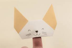 First, fold ¼ sheet of paper into half. Origami Finger Puppet Tutorial