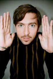 Succession" Star Nicholas Braun Tries On Some Sweaters