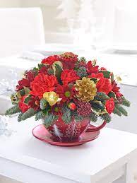 One clever florist figured out how to transform. Classic Christmas Teacup Arrangement Christmas Flower Delivery Christmas Flowers Flower Delivery