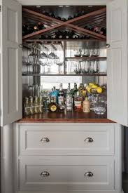 This bar cabinet brings an array of storage options to your dining room or kitchen. Bespoke Drinks Cabinet Wine Storage Charlie Kingham Surrey