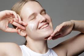 Young Woman with Facial Cream