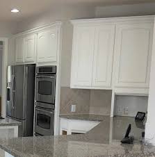 Here is another kitchen design with white cabinets and slate appliances. 5 Tips Painting Dark Kitchen Cabinets White And The Mistakes I Made