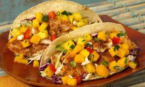Prepare the mango salsa by combining the mango, red bell pepper, red onion, cilantro, and jalapeno pepper in a bowl. Tilapia Fish Tacos With Mango Salsa
