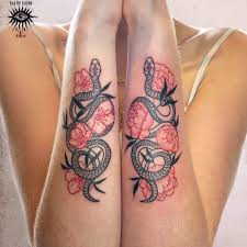 Black and grey floral snake tattoo on the forearm. Tattoos By Ella Eve Couple Of Matching Snakes From Yesterday