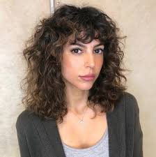 Fade hairstyles is in family with the undercut, here we bring you this curly fringe hairstyle. 50 Best Styles For Medium Length Hair With Bangs Hair Adviser