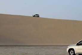 Sunset desert safari med camel ride och sandboarding. The Hotel Card Activity Inland Sea Desert Safari With