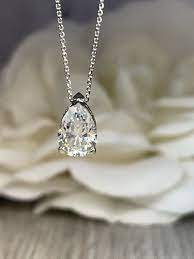 Moissanite Pear Shape Pendant Necklace 14k White Gold Teardrop Pendant For Ladies Moissanite Necklace Simple Pendant Dainty Necklace 4624 In 2021 Pear Shaped Pendant Blue Sapphire Studs White Gold Set