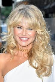 Christie Brinkley, 64, looks incredible in a white jumpsuit as she arrives  at magazine launch in New York