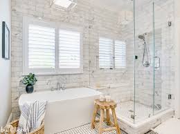 This white and gray bathroom features ikea vanities and herringbone floor. Greek Key Marble Tile Bathroom Reveal Bella Tucker