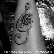 Touch device users, explore by. Music Note Rose Tattoo Musicnote Rosetattoo Girlstattoo Blackink Tatttoos Tattooahmedabad Tattoobyket Rose Tattoos Music Tattoo Designs Trendy Tattoos