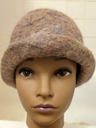 Thank you for letting me join. I made this little hat, bottom up, from  Bluefaced Leicester roving, using Father stitch.