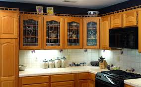 black kitchen cabinets glass panels