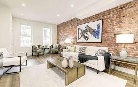 This is an example that the brick wall can be used in a traditional family home. Exposed Brick Wall Living Room Design Ideas Designing Idea
