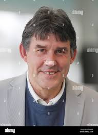 Essen, Germany. 09th Mar, 2023. Ralf Becker, head of the pool operation, is  looking for lifeguards for the summer with a poster "Working where others  go