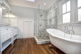 The clawfoot tub is lofted, and tucked beneath the angled ceiling, creating a comfortable and somewhat secluded space. Refreshing Luxury Carolina Craftsman Builders