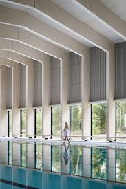 Swimming Pool In London Is Built Out Of Wooden Portal Frames And Cross Laminated Timber Swimming Pool Architecture Indoor Swimming Pools Indoor Swimming