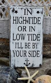 anchor beach sign in high tide or low tide wood hand