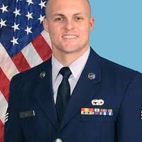 Command Sgt. Maj. Harley J. Schwind Jr. passes the