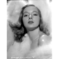 Evelyn Keyes Surrounded with Furr and posed Photo Print (8 x 10)