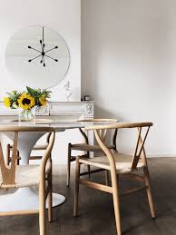 Minimal Wishbone Chair Tulip Table Knoll Sunflowers Marble Fireplace Round Mirror Wooden Floor Knoll Dining Chair Dining Table Chairs Marble Tulip Table