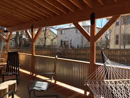 Covered Deck With Corrugated Metal Roof And Rails 16 X 30 Redwood Decking Black Metal Fasteners Homeo Metal Deck Railing Corrugated Metal Roof Metal Roof
