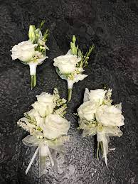The dress has sequins on it and has flower embellishment. Wedding Lapel Arrangement Mother Of Bride Corsage Corsage Wedding Corsage