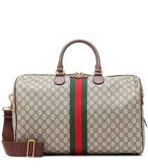 Gucci Ophidia Gg Travel Bag The Timeless Design Of The Gg Supreme Travel Bag Is Inspired By Gucci S Heritage Motif Gucci Travel Bag Trendy Travel Bags Bags