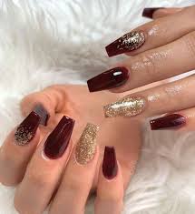 On a coffin nail, burgundy features a lush, elegant wine hue in a matte finish. So Cute Coffin Shaped Maroon Nails With Gold Glitter Design Maroon Nails The Best Nail Trends For Cute Fa Gold Acrylic Nails Gold Glitter Nails Burgundy Nails