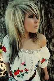 This emo hairstyle suits best to thin fine hair and the stylist has chopped her layers along her shoulders and the model has also got the edges of her longer layers slightly curled. 15 Cute And Groovy Emo Hairstyles For Girls