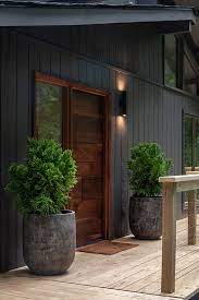 Royal ironstone dark grey siding and dark grey shakes, white trim, and certainteed landmark weathered wood roofing in morton il. A Gorgeous Home Entry Fit For The Forest Black House Exterior Exterior House Colors House Paint Exterior